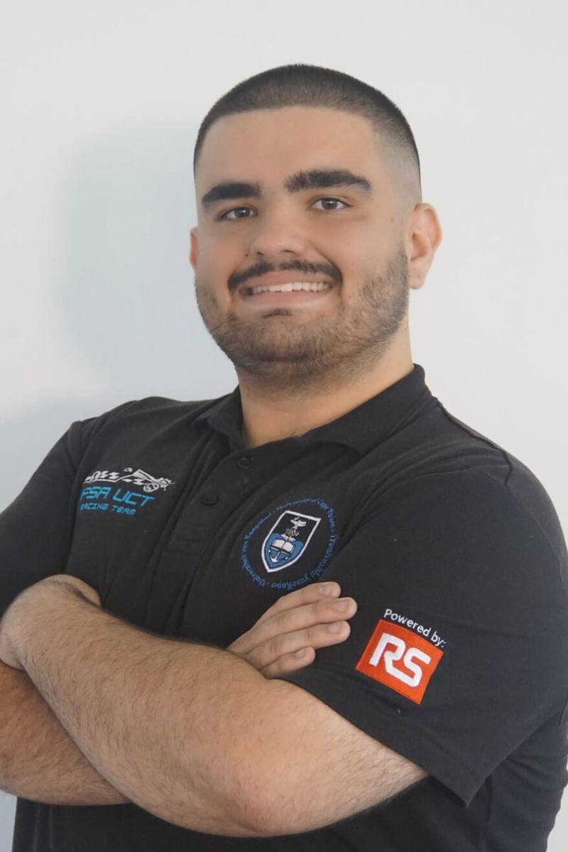 Henrique De Franca, arms folded, in a black UCT Racing team polo.